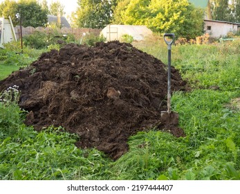 heap of compost in the farmer's vegetable garden.organic fertilizer for the soil - Shutterstock ID 2197444407