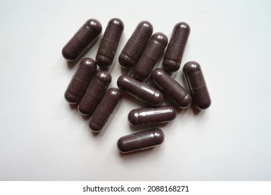 Heap Of Dark Purple Capsules Of Bilberry Extract Dietary Supplement