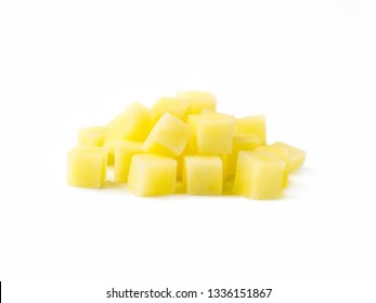 Heap of diced raw potatoes isolated on white background. Pile uncooked potatoes cube. Isolated on white with clipping path.