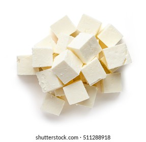 Heap of diced soft cheese isolated on white background, top view