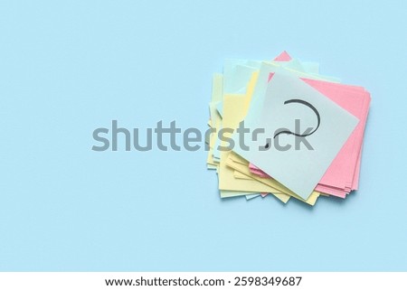 Heap of different sticky notes with question mark on color background