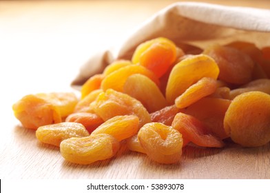 Heap Of Dried Apricots Spill Out Canvas Bag.