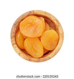 Heap Of Dried Apricots In Wood Bowl From Above, Isolated On White Background