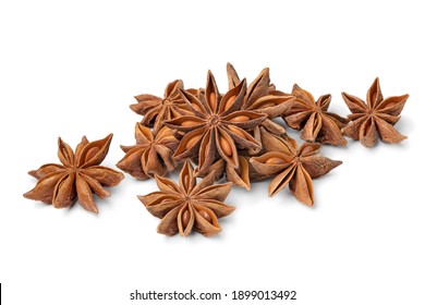 Heap of dried star anise close up isolated on white background 