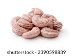 Heap of dried unpeeled cashews isolated on white.