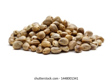 Heap of dry hemp seeds isolated on white background