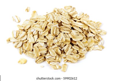 Heap Of Dry Rolled Oats Isolated On White Background