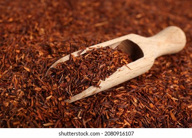 Heap Of Dry Rooibos Tea Leaves With Wooden Scoop, Closeup View