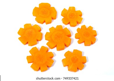 Heap Of Fresh Carrot Slices In Star Shape On A White Background