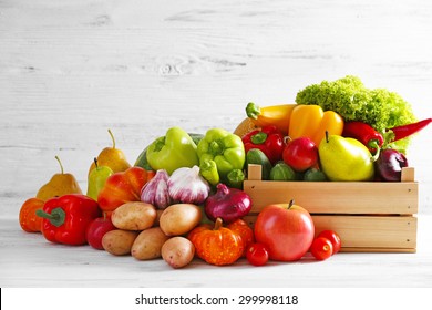 Heap of fresh fruits and vegetables on wooden background - Powered by Shutterstock