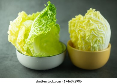 Heap Fresh Of Green Leaf Iceberg Lettuce For Wrap Thai Food In Bowl On Black Background