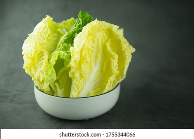 Heap Fresh Of Green Leaf Iceberg Lettuce For Wrap Thai Food In Bowl On Black Background