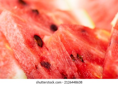 Heap of fresh sliced watermelon as textured background. Sweet and juicy sliced watermelon.