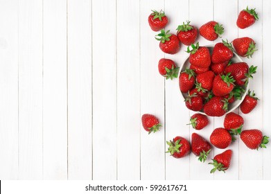 Heap of fresh strawberries in bowl on white wooden background. Top view point. - Powered by Shutterstock