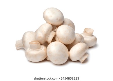 Heap of fresh whole champignons, Button mushrooms,close up isolated on white background  