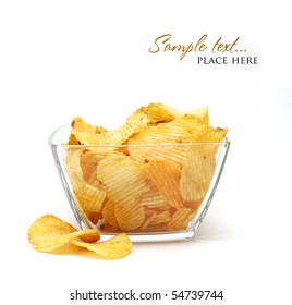 Heap Of Fried Potato Chips In Glass Bowl On White Background.