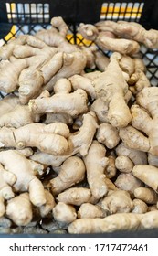 A Heap Of Ginger Root In A Sale Bin At A Supermarket. Texture. Top View. Healthy Lifestyle. Vertical.