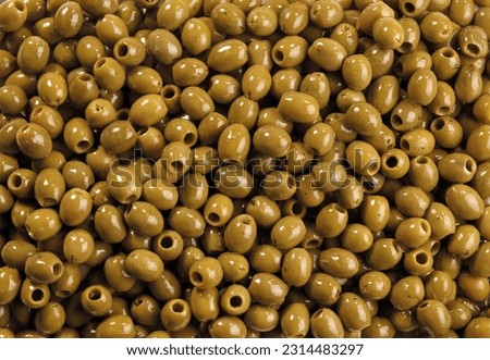 heap of green olives, top view, background