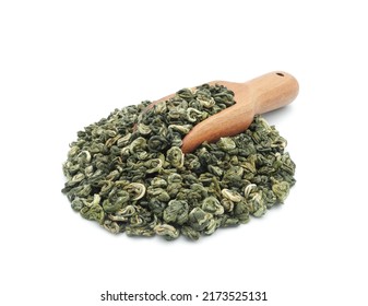 Heap of high quality green tea with wooden measuring scoop close up isolated on white background                             