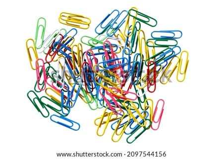 Similar – Colorful paper clips on a black board surface