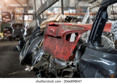 Heap of old rusty disassembled car parts at workshop waste storage hangar indoor. Vehicle salvage dismantling garage. Iron auto spare details trunk pile for recycling at scrap junkyard - Shutterstock ID 2066898047