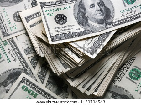 heap of one hundred dollars notes 