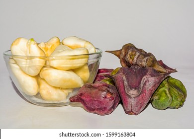 Heap Of Peeled Water Caltrop Or Water Chestnut Fruit In A Glass Bowl On White Background.Close Up And Side Angle View.