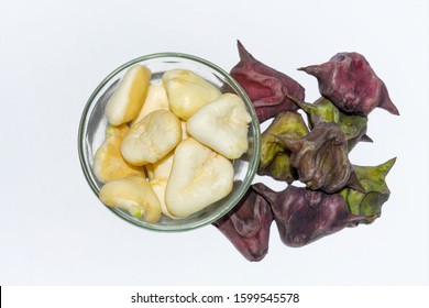 Heap Of Peeled Water Caltrop Or Water Chestnut Fruit In A Glass Bowl On White Background.Top View.