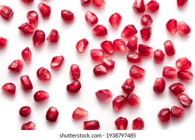 heap of pomegranate seeds isolated on white background
