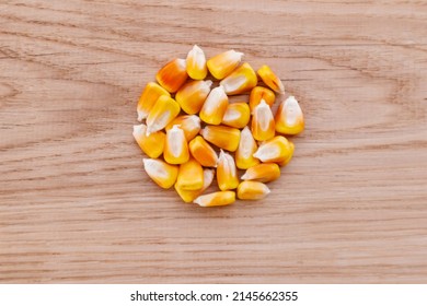 Heap Of Raw Corns Seeds, Maize Or Sweetcorn Kernels Top View On Wooden Background.