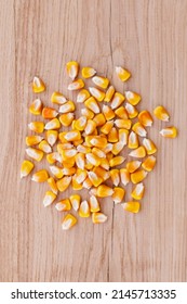 Heap Of Raw Corns Seeds, Maize Or Sweetcorn Kernels Top View On Wooden Background.