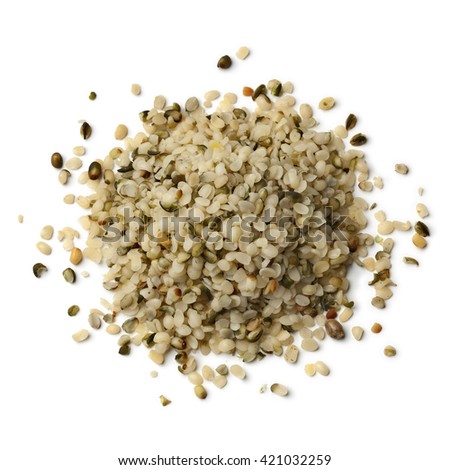 Heap of raw peeled hemp seeds on white background 