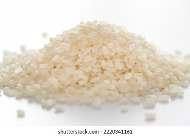 Heap Of Raw White Rice Grains