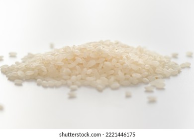 Heap Of Raw White Rice Grains