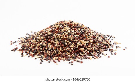 Heap of red, white and black quinoa seeds isolated, panorama