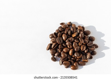 Heap of Robusta, Arabica coffee beans isolated on white background, copy space, top view. Coffee beans for latte - Powered by Shutterstock