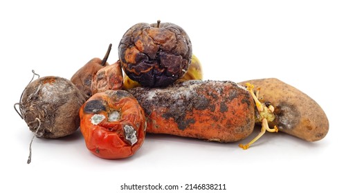 Heap of rotten vegetables and fruits isolated on a white background. - Shutterstock ID 2146838211