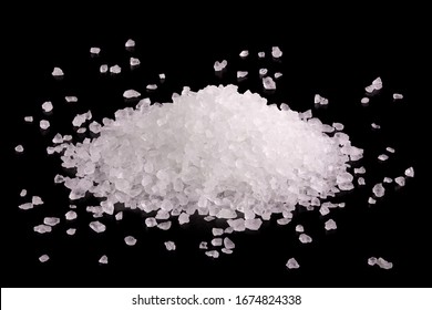 Heap of salt close-up. Crystals of white sea salt. Salt close up. Coarse salt on a black background. 