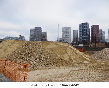 heap of sand in construction site and modern building in the background, Paris, France