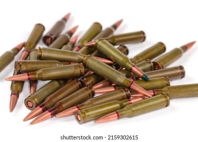 Heap Of The Service Rifle Cartridges On A White Background, Side View Close-up In Selective Focus
