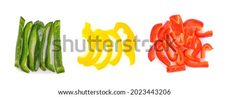 Heap of sliced green, yellow, red bell pepper isolated white background. Top view