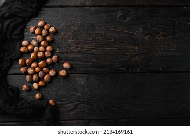 Heap Or Stack Of Hazelnuts Set, On Black Wooden Table Background, Top View Flat Lay, With Copy Space For Text