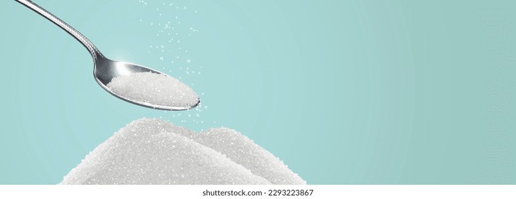 heap of sugar being picked up by a spoon
