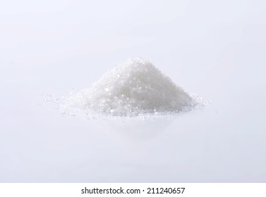 Heap Of Sugar On White Background