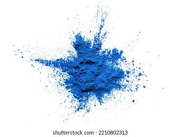 Heap of superfood blue spirulina powder on white background. Blue algae spirulina, butterfly pea flower, or blue matcha powder. Top view, free space for text or design.