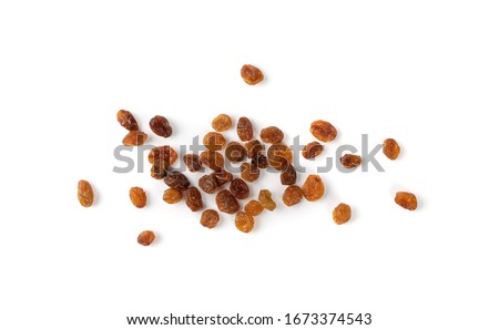 Heap of sweet raisins isolated on white background. Dried grapes pile, handful of dark brown raisin top view