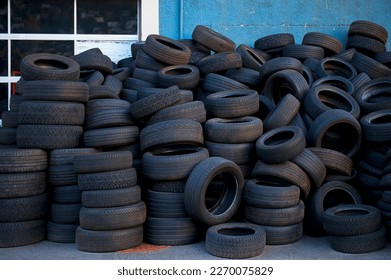 Heap of tires in front of the car workshop - Powered by Shutterstock