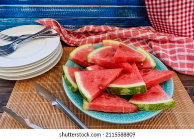 Heap of triangular pieces of a sweet, cold and delicious watermelon prepared to serve on a large plate. Healthy, fresh and natural food. Season fruits. - Powered by Shutterstock