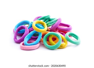 Heap of various hair ties. Multicolored elastics isolated on white background