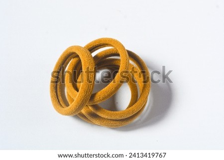 Heap of various hair ties. multicolored elastics isolated  on white background